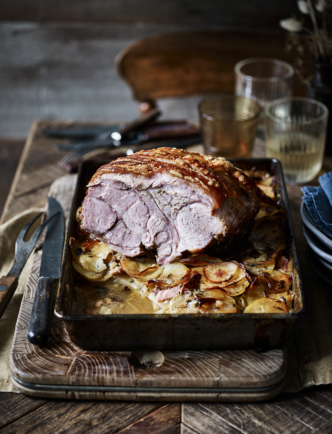Roast pork on a bed of cidersoaked potatoes recipe Sainsbury`s Magazine