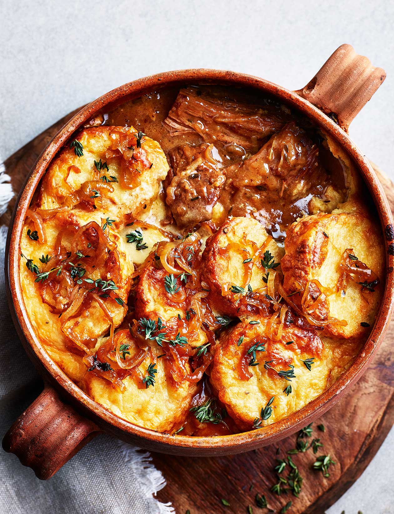 French onion beef stew with gruyère gratin recipe French onion beef stew with Gruyère gratin recipe | Sainsbury`s Magazine