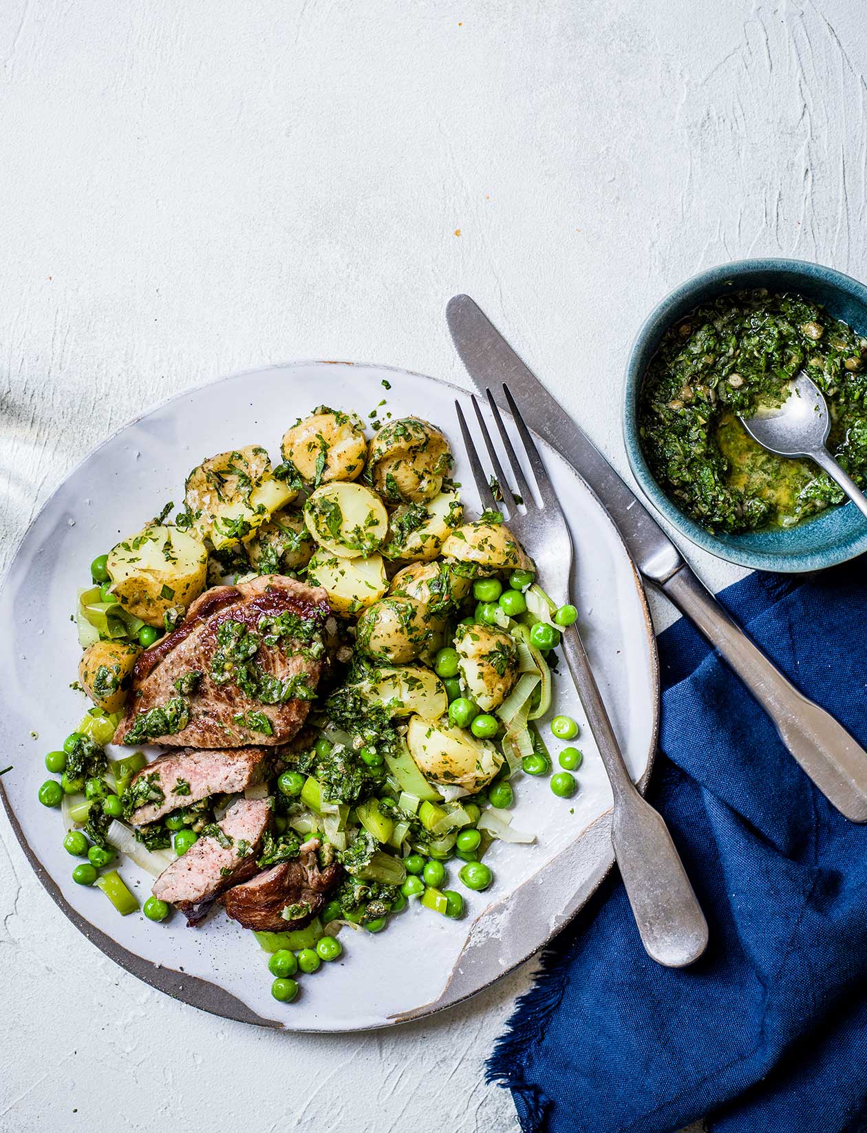 Minty salsa verde lamb with lemony potatoes and leeks recipe