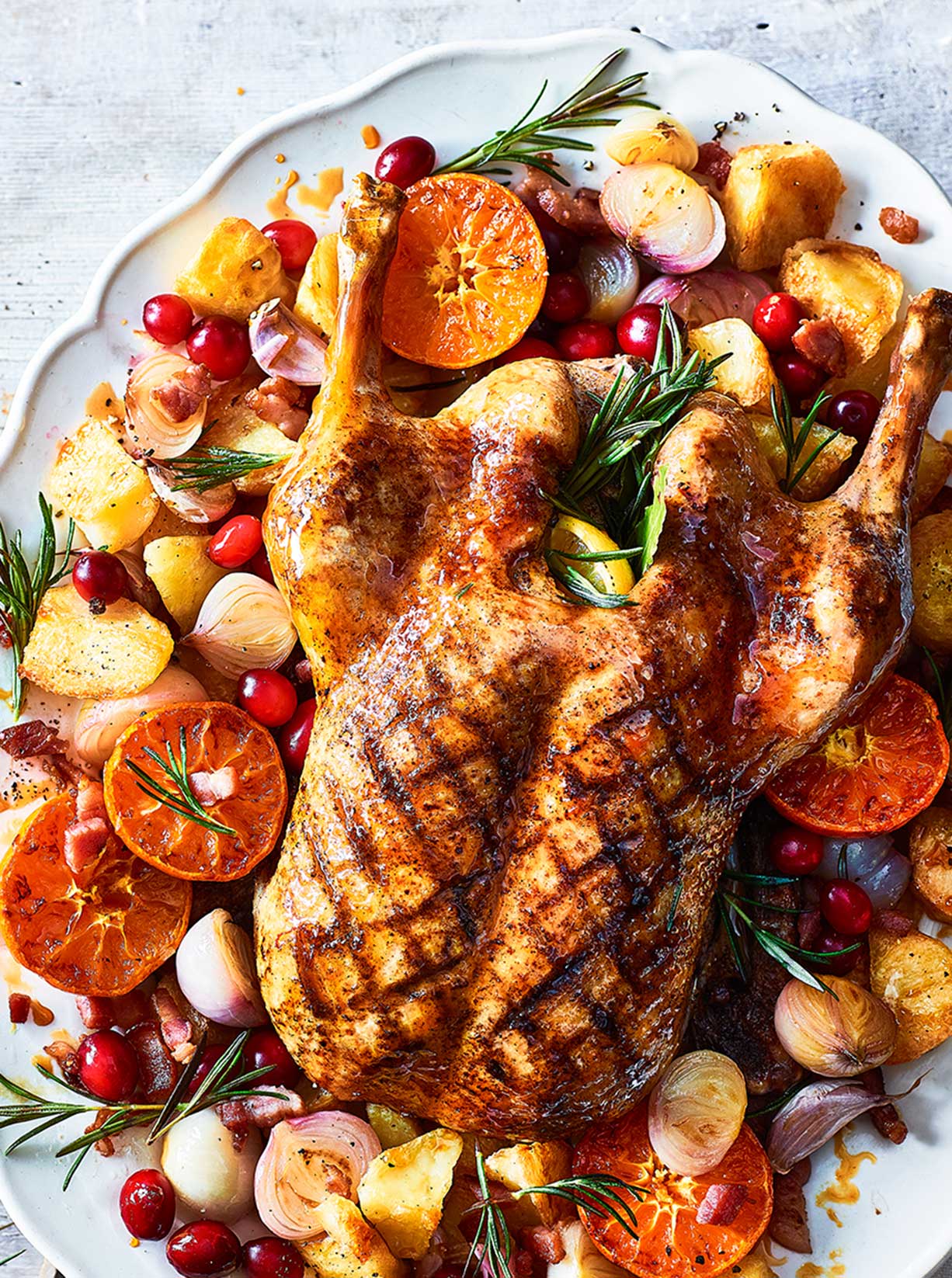 Sticky citrus roast duck with crispy potatoes recipe | Sainsbury`s Magazine