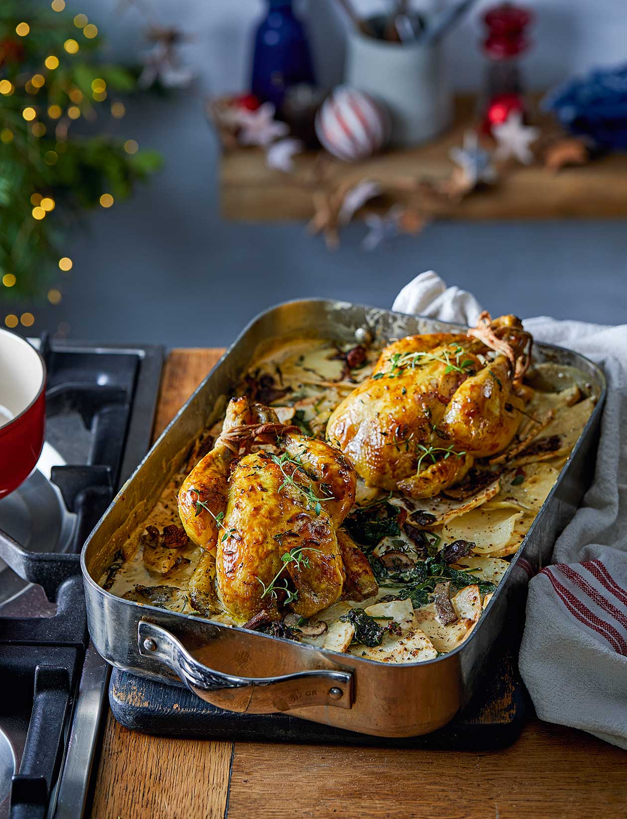 Poussins with potato, celeriac and porcini gratin recipe | Sainsbury`s Magazine