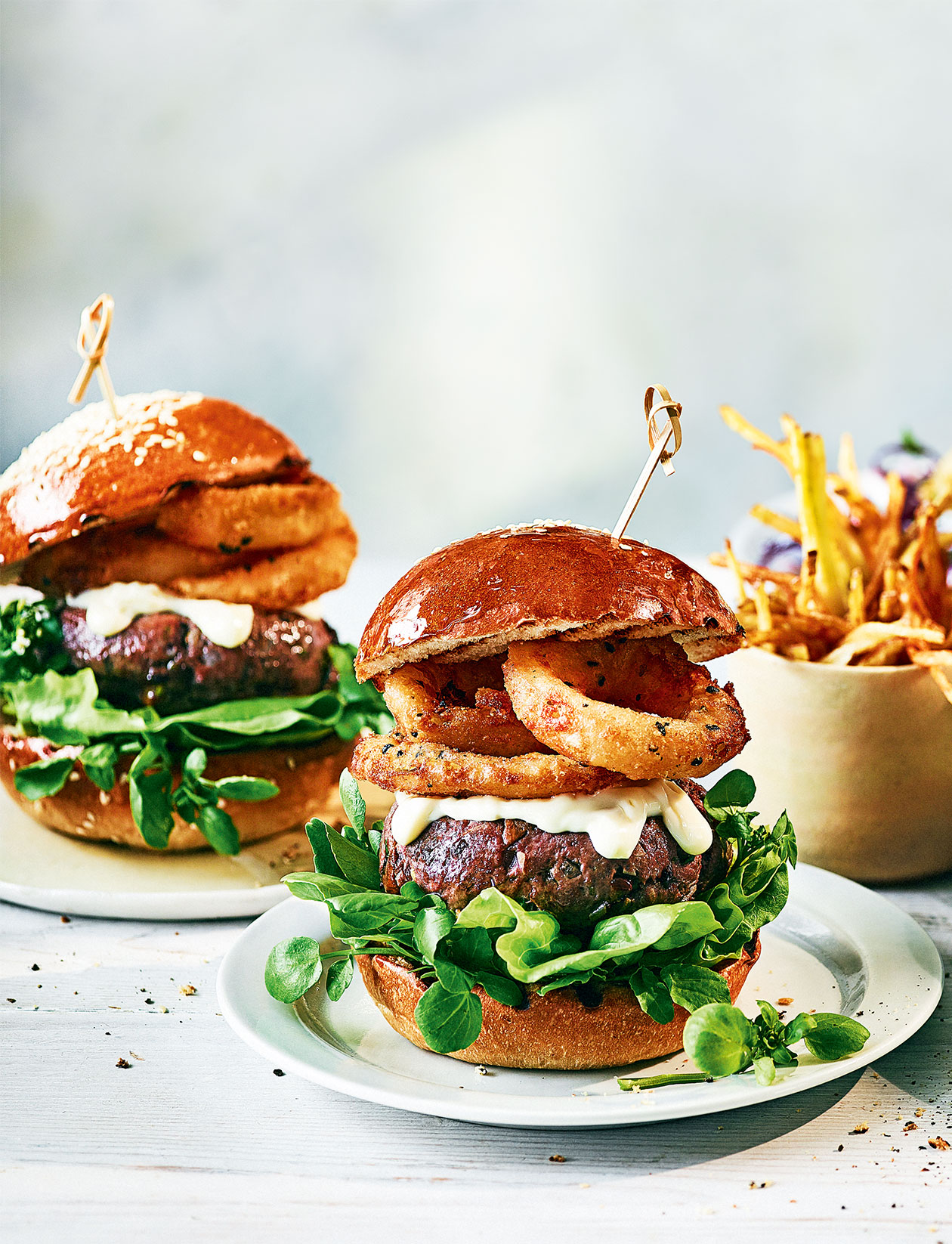 Beef and porcini burger with truffle mayo and crispy onion rings recipe | Sainsbury`s Magazine