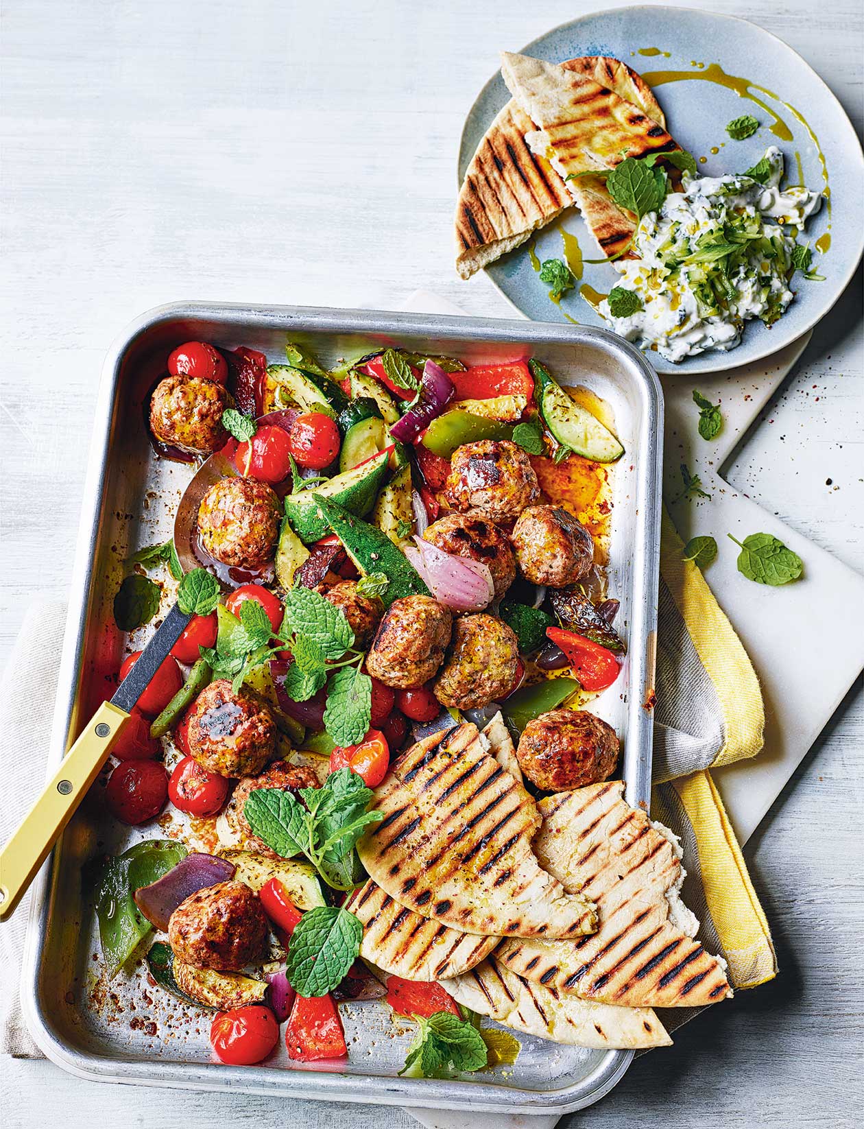 Greek-style lamb traybake recipe | Sainsbury`s Magazine