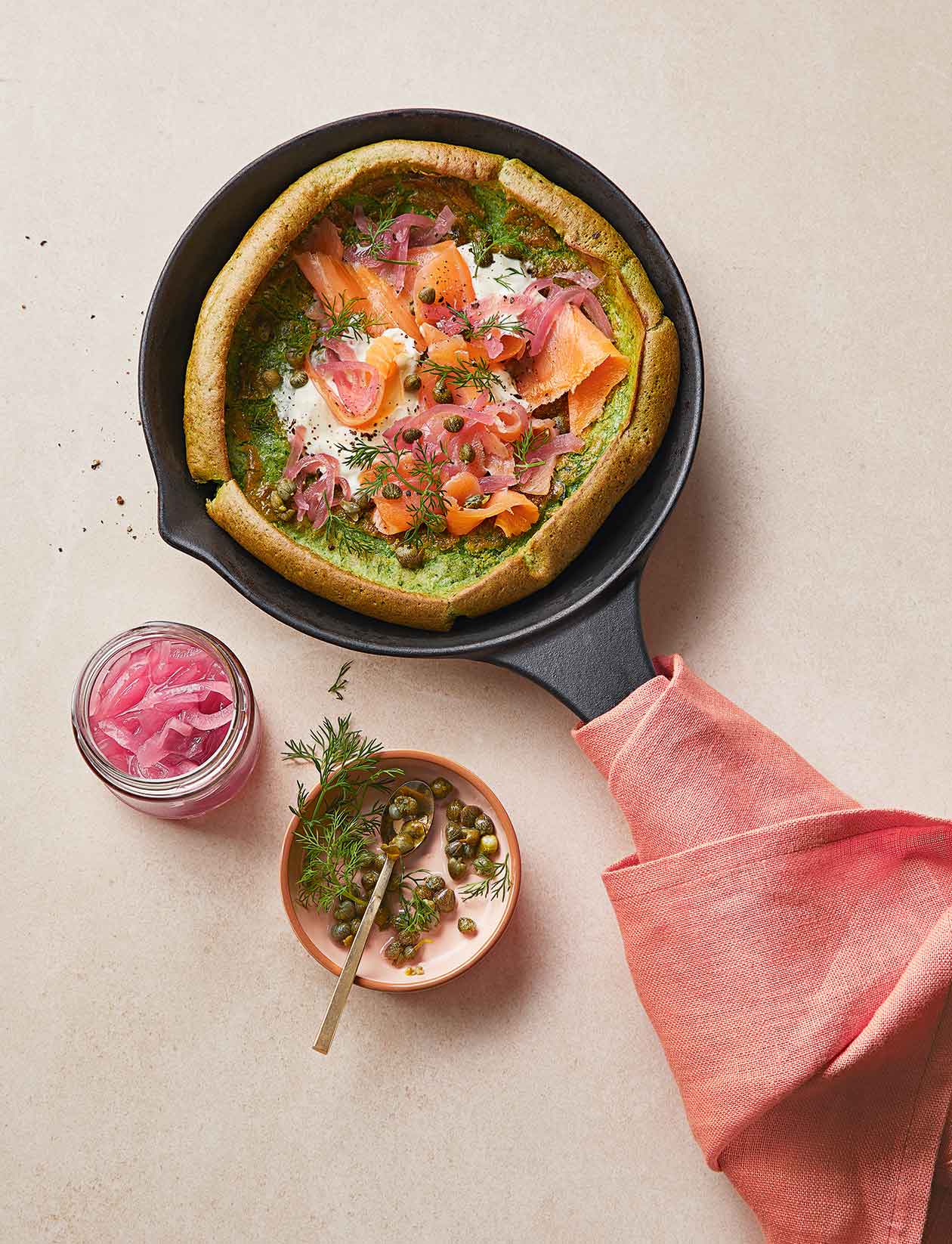 Spinach dutch baby with smoked salmon recipe | Sainsbury`s Magazine
