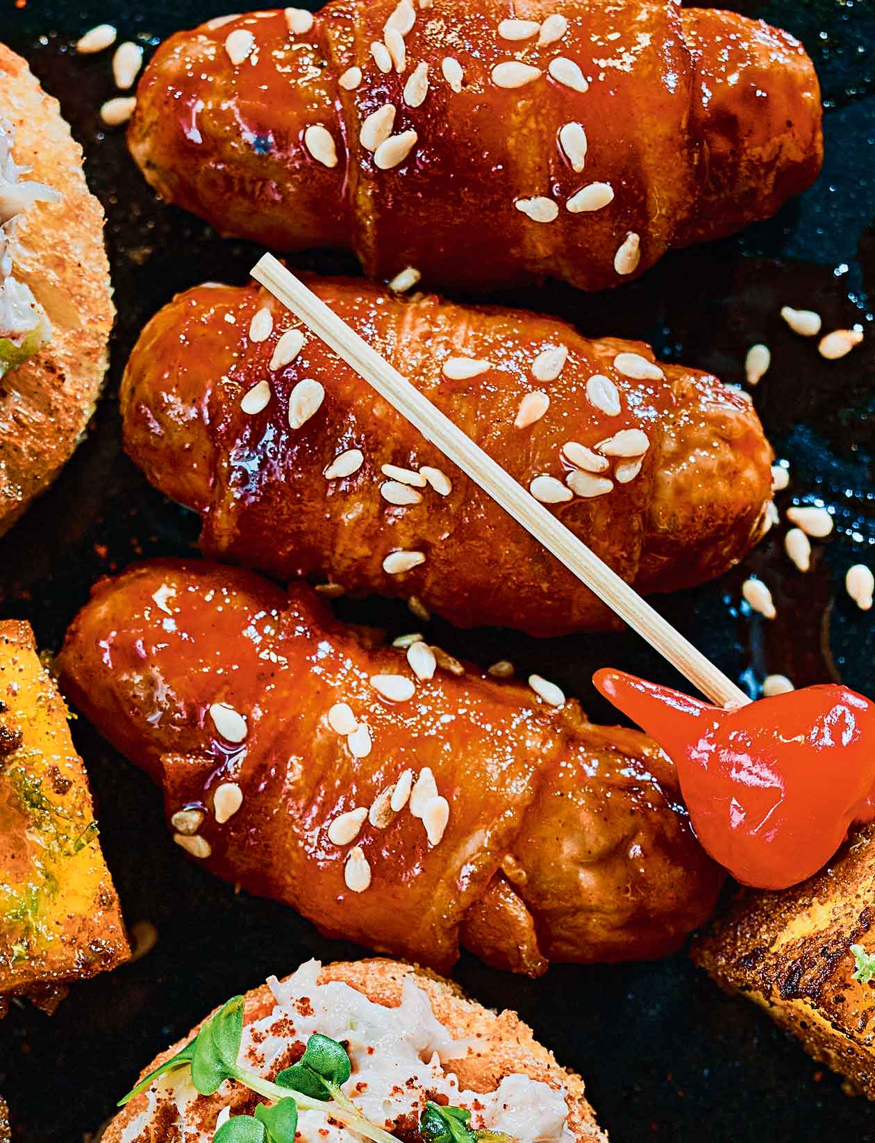 Sticky gochujang pigs in blankets recipe | Sainsbury`s Magazine