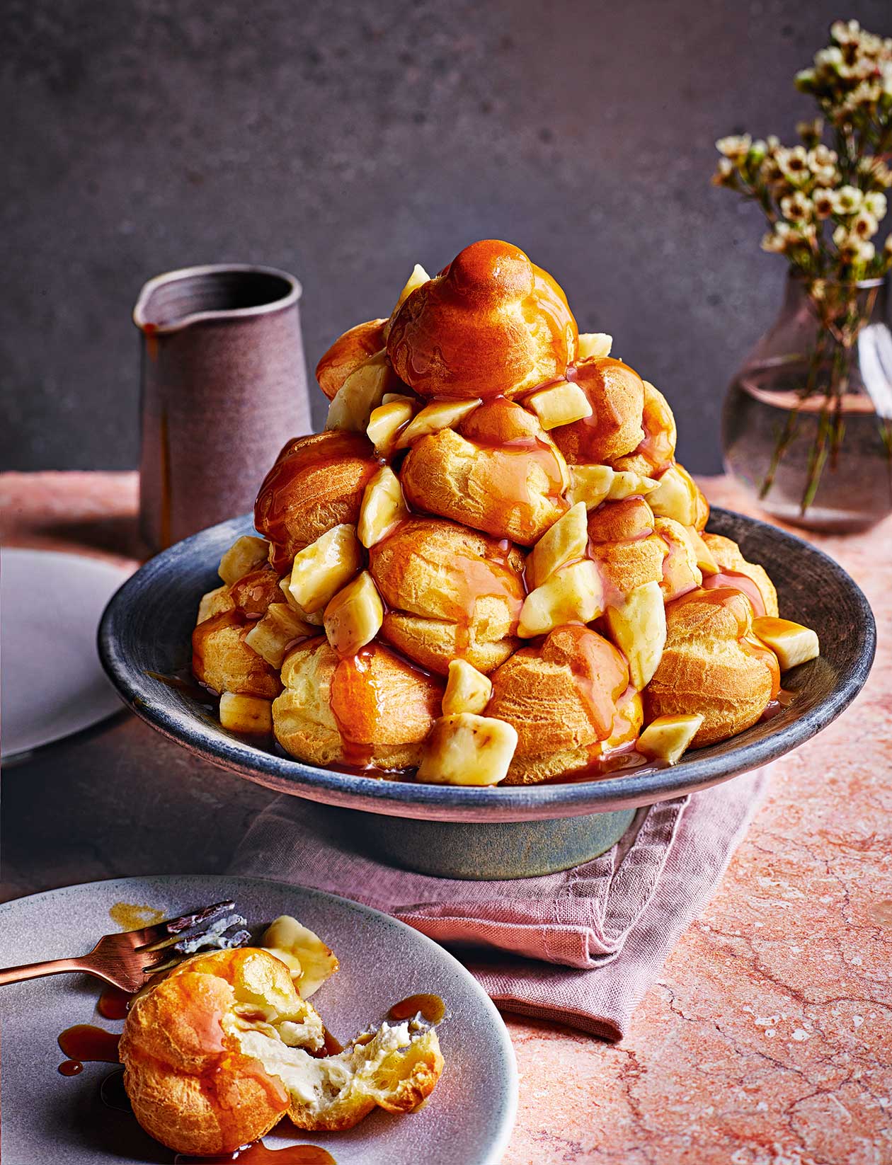 Cheesecake profiteroles with banana toffee sauce recipe | Sainsbury`s Magazine