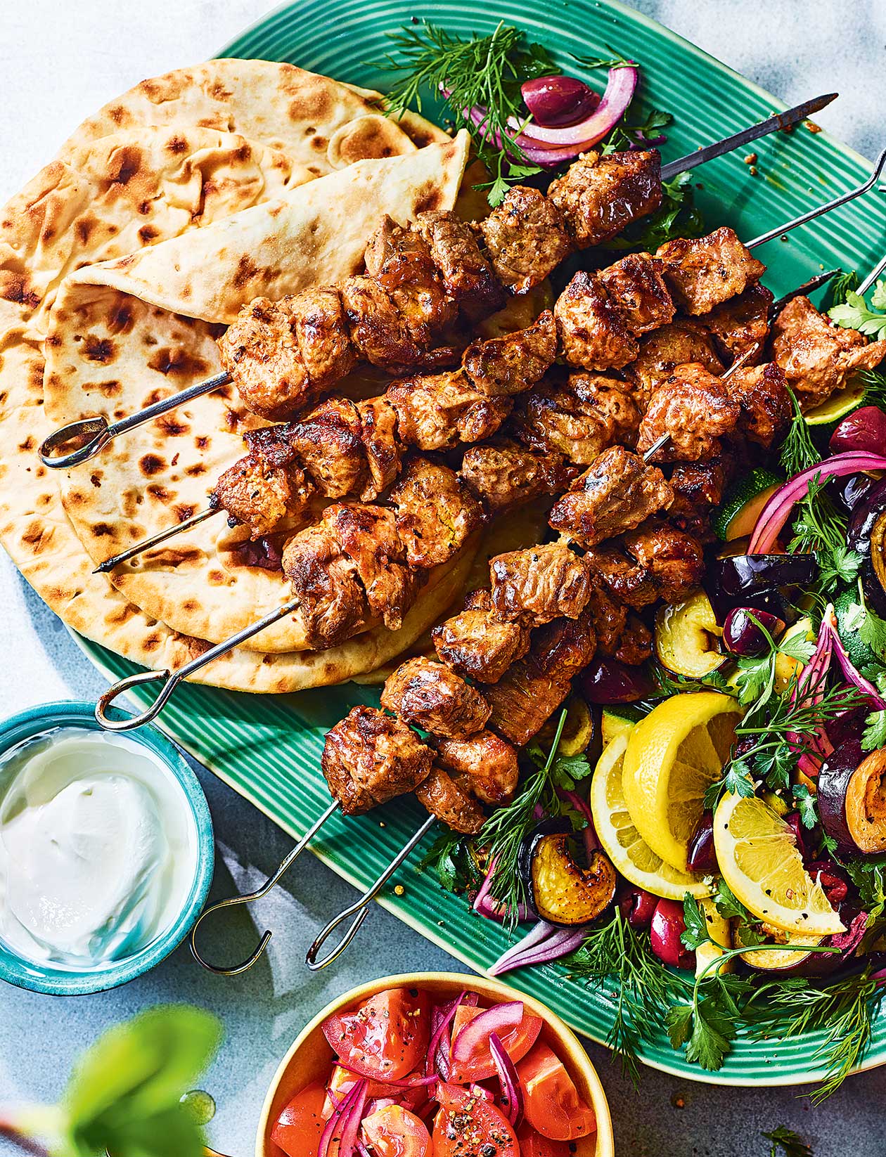 Mayo-marinated lamb skewers with aubergine, courgette and olive salad recipe | Sainsbury`s Magazine
