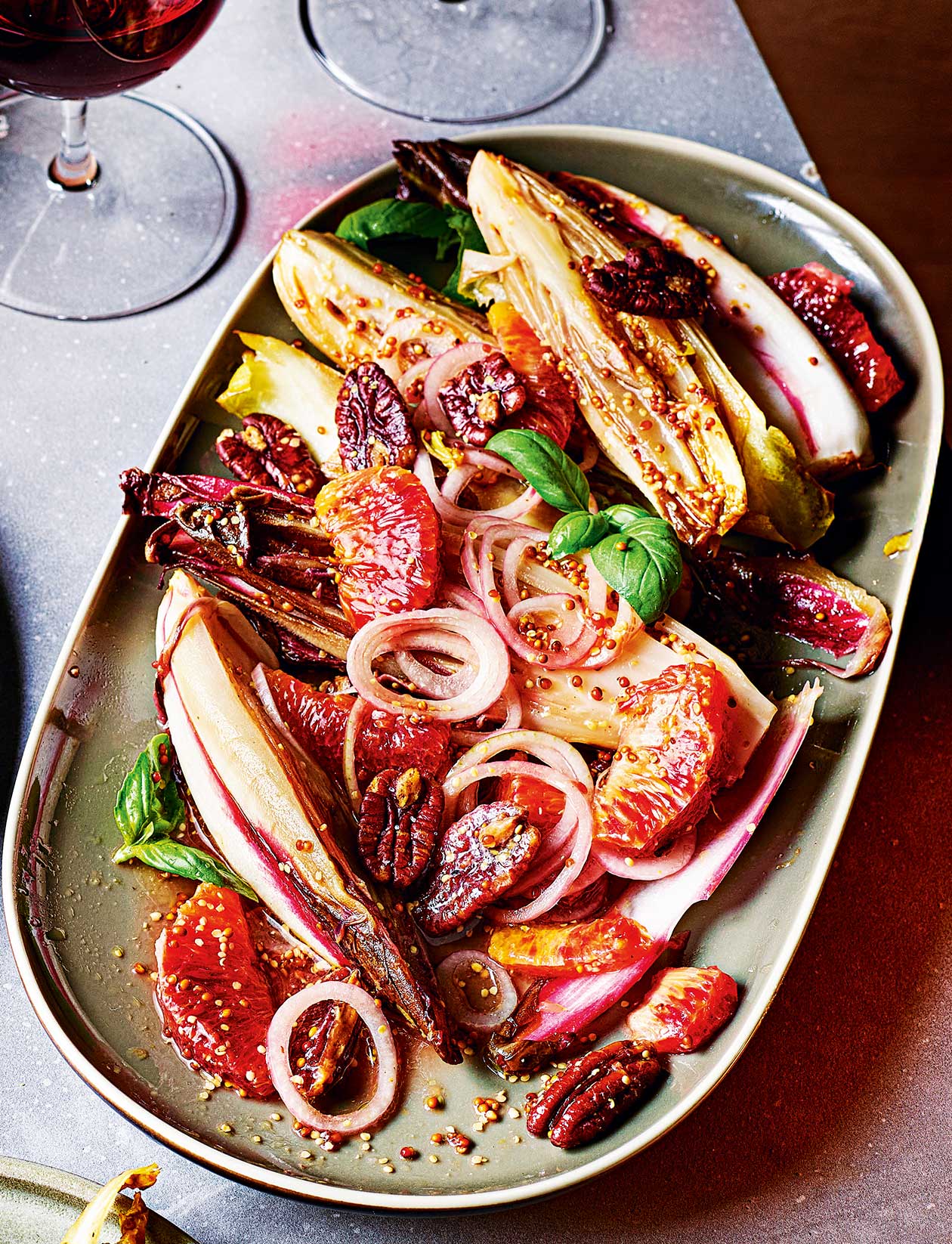 Roasted chicory with blood orange and salted pecans recipe | Sainsbury`s Magazine