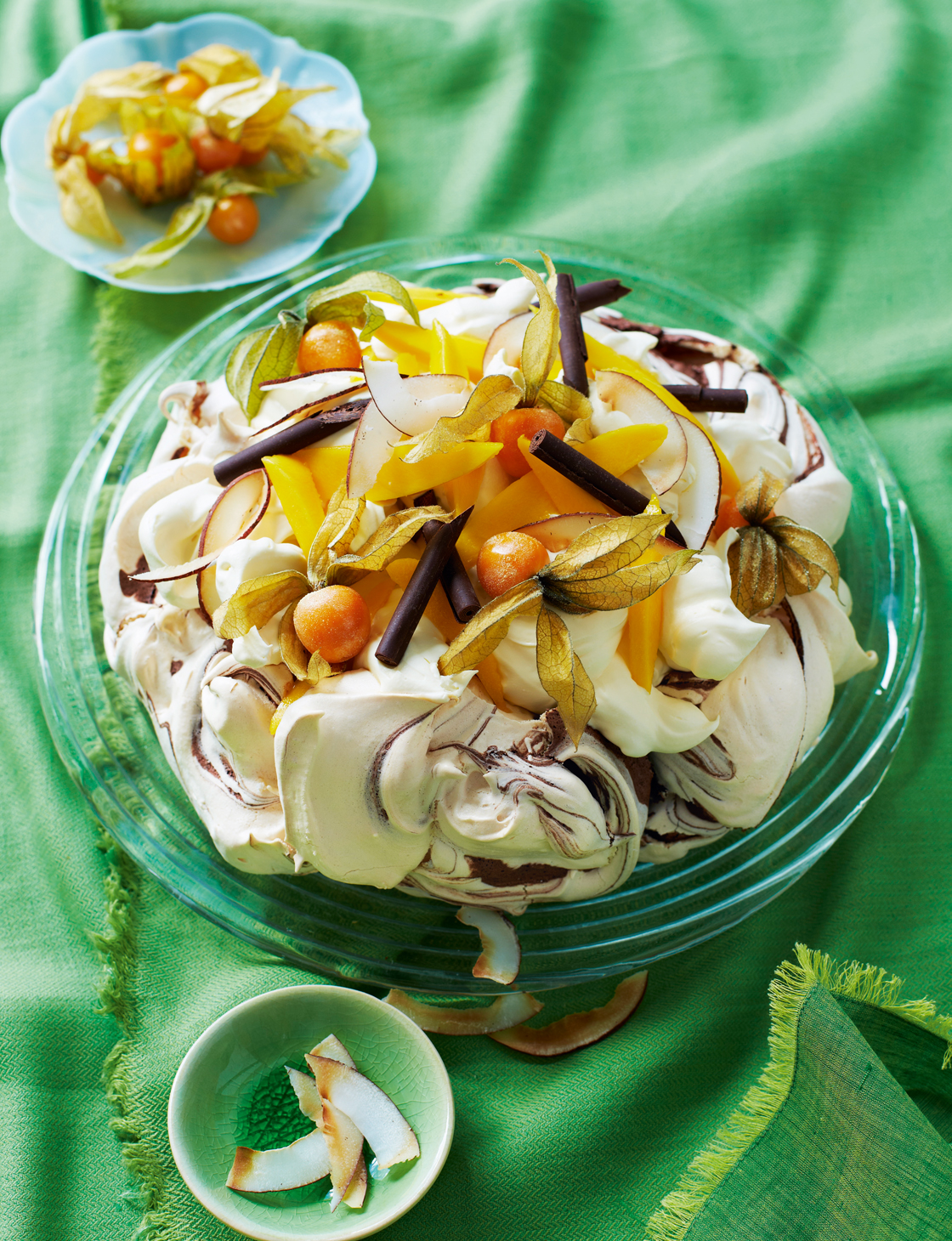 Chocolate swirl pavlova with mango and physalis | Sainsbury`s Magazine