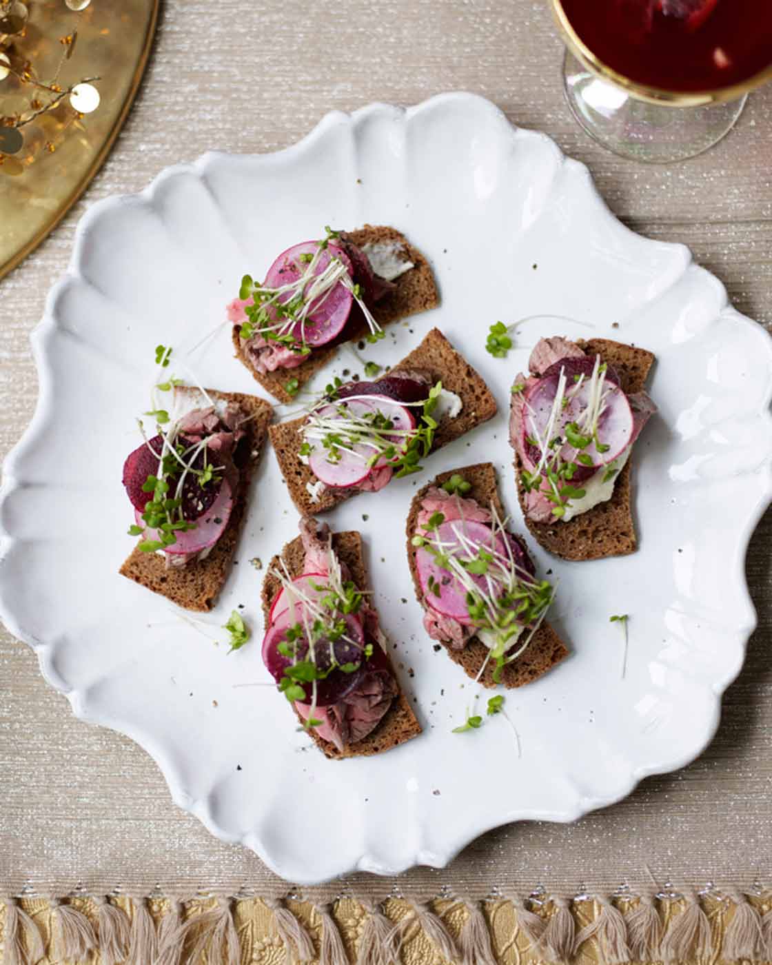 Crispy rye toasts with rare roast beef, beetroot and radish Sainsbury`s Magazine