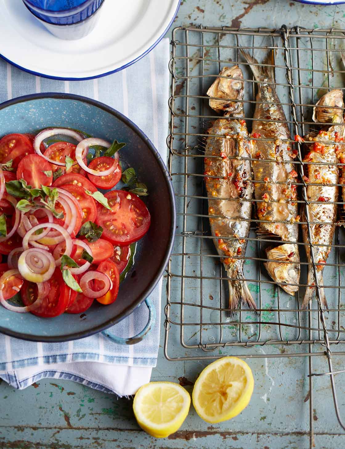 Barbecued piri piri sardines with tomato and onion salad | Sainsbury`s Magazine