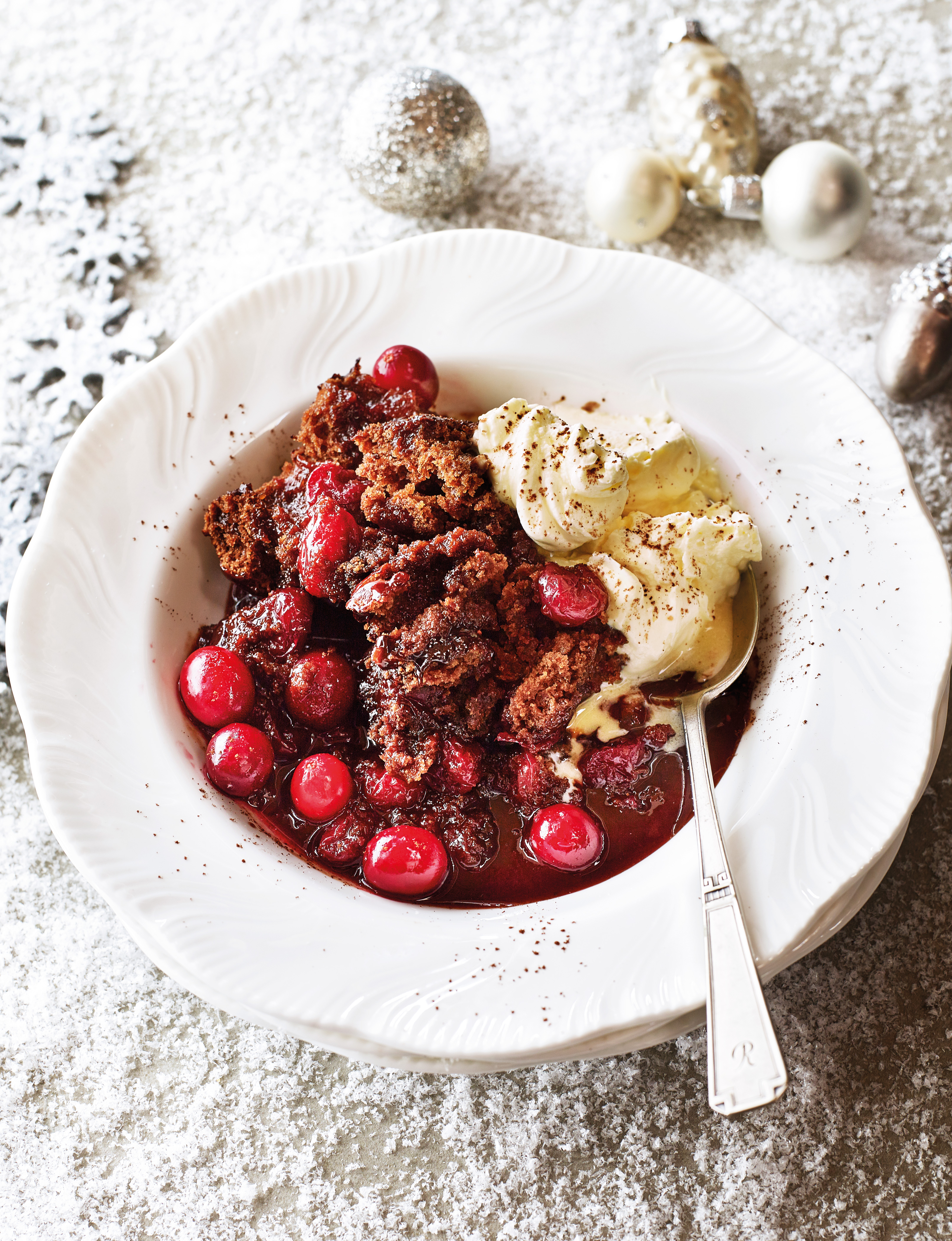 Selfsaucing chocolate cranberry pudding with cinnamon cream Sainsbury`s Magazine