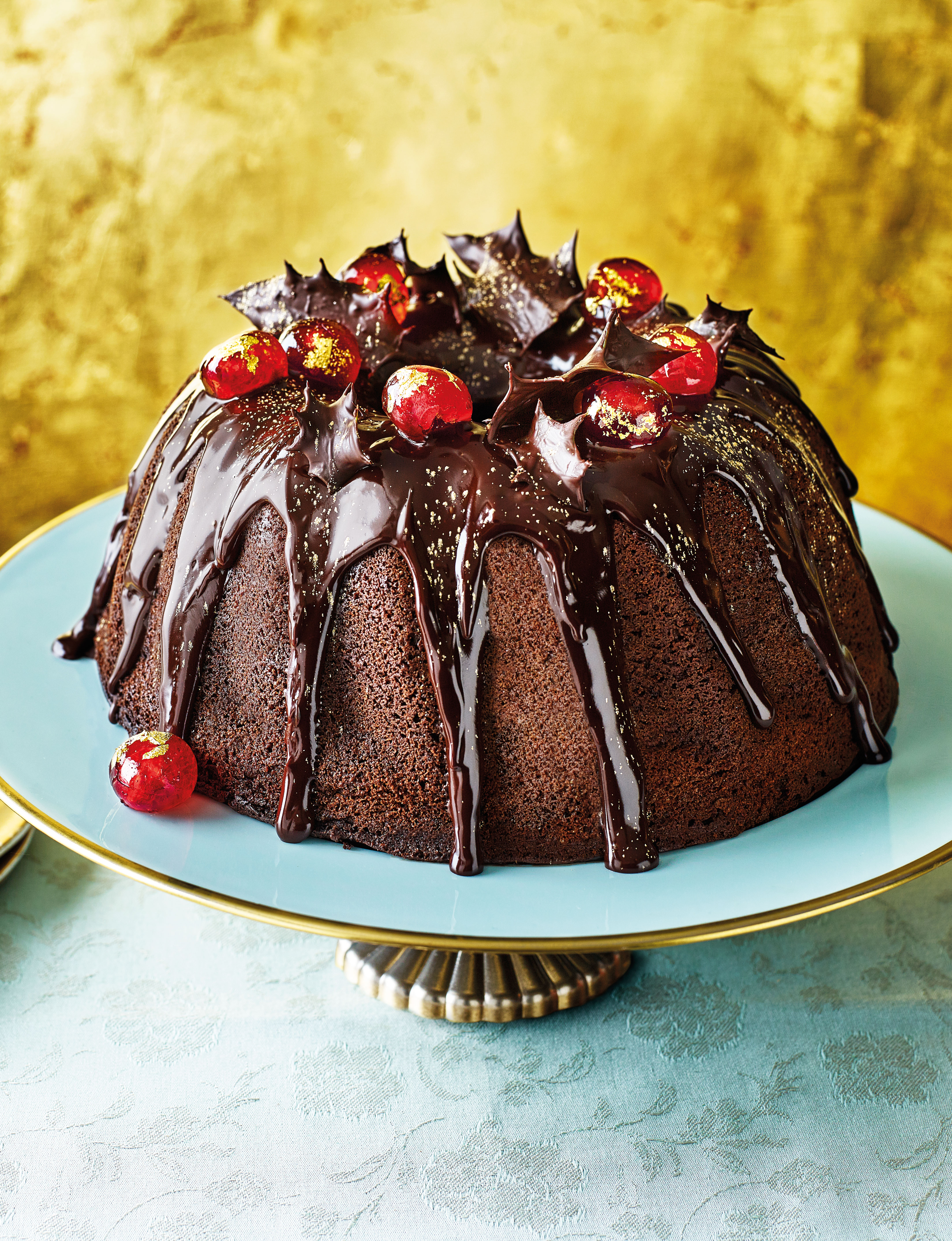 Mulled wine bundt cake with chocolate holly and gilded cherries