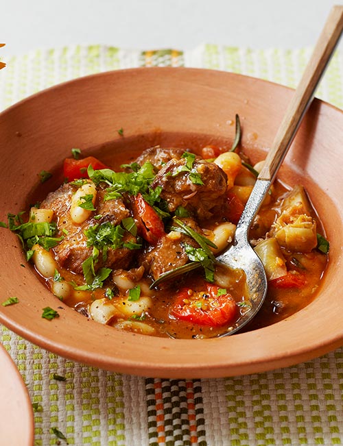Lamb stew with artichokes, cannellini beans and sunsoaked tomatoes | Sainsbury`s Magazine