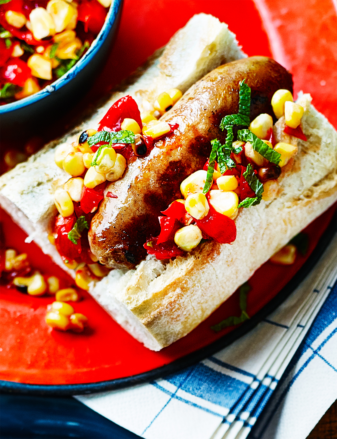 Sausages with spicy charred corn salsa | Sainsbury`s Magazine
