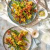 Scrambled eggs with asparagus, salami and oregano