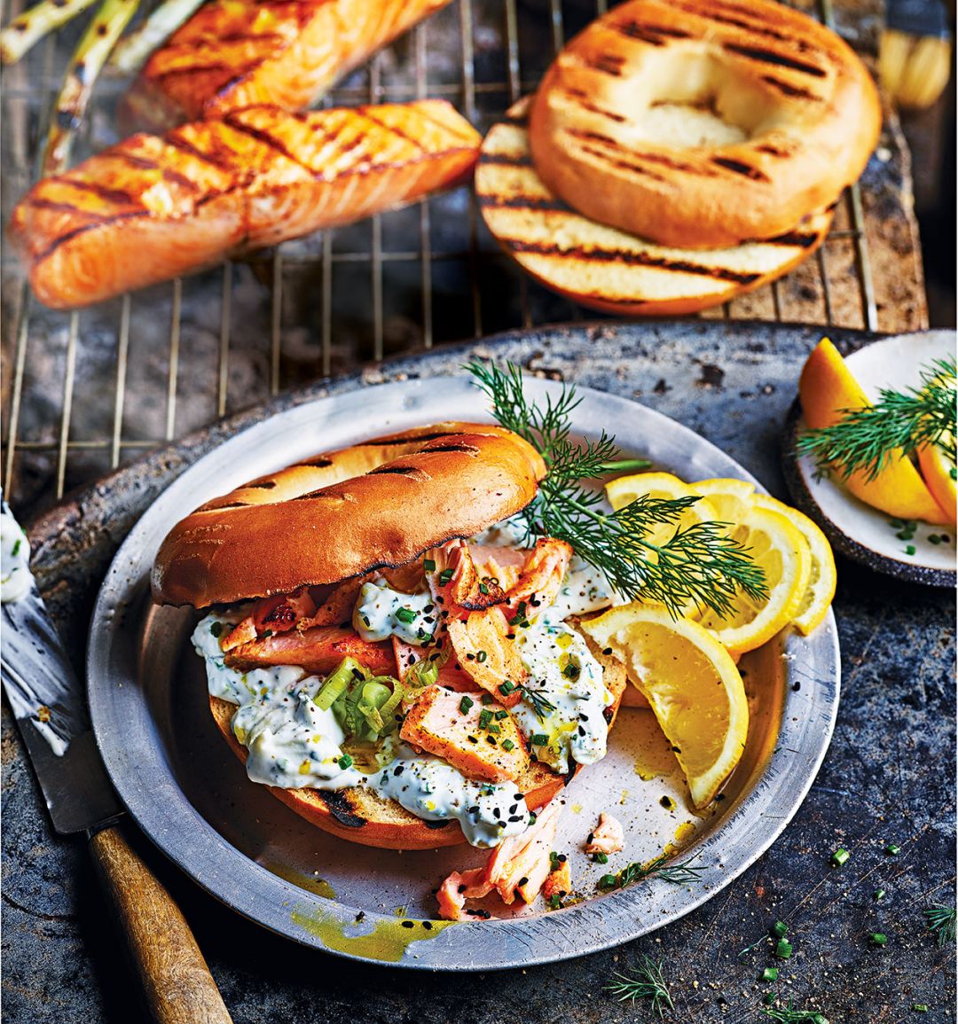 Hot smoked salmon bagels with spring onion and herb soft cheese