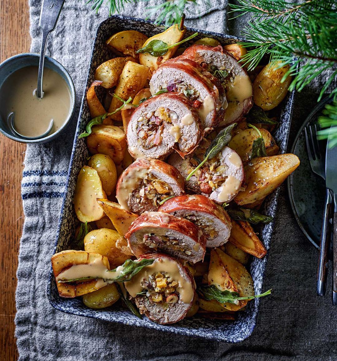 Sage and apricot-stuffed pork tenderloin with roasted pear, parsnip and potato