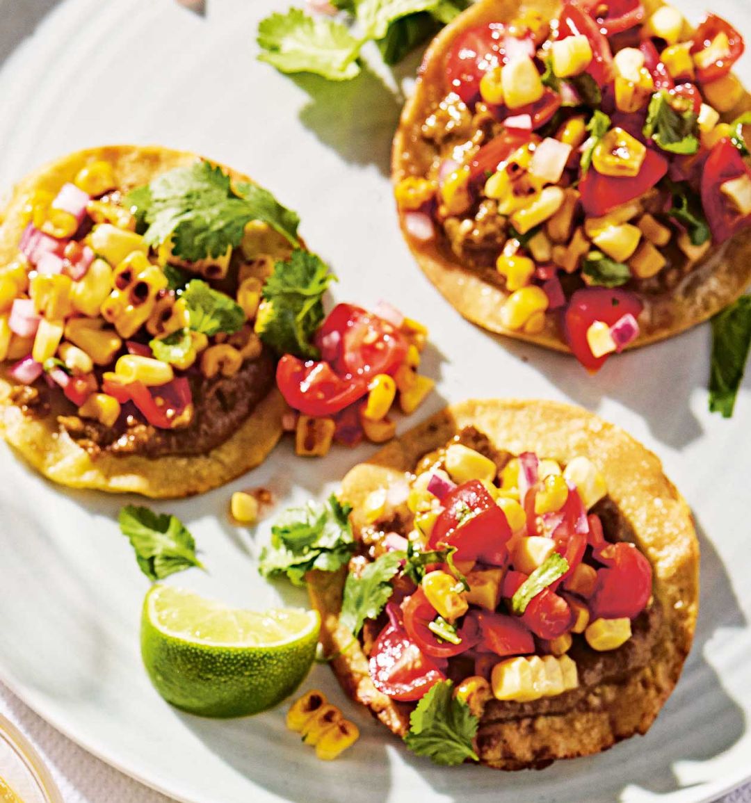 Charred corn and tomato tostadas with smoked mussel purée