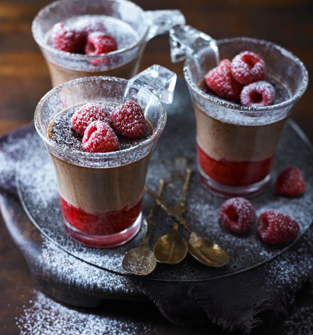 Velvety milk chocolate pots with raspberries