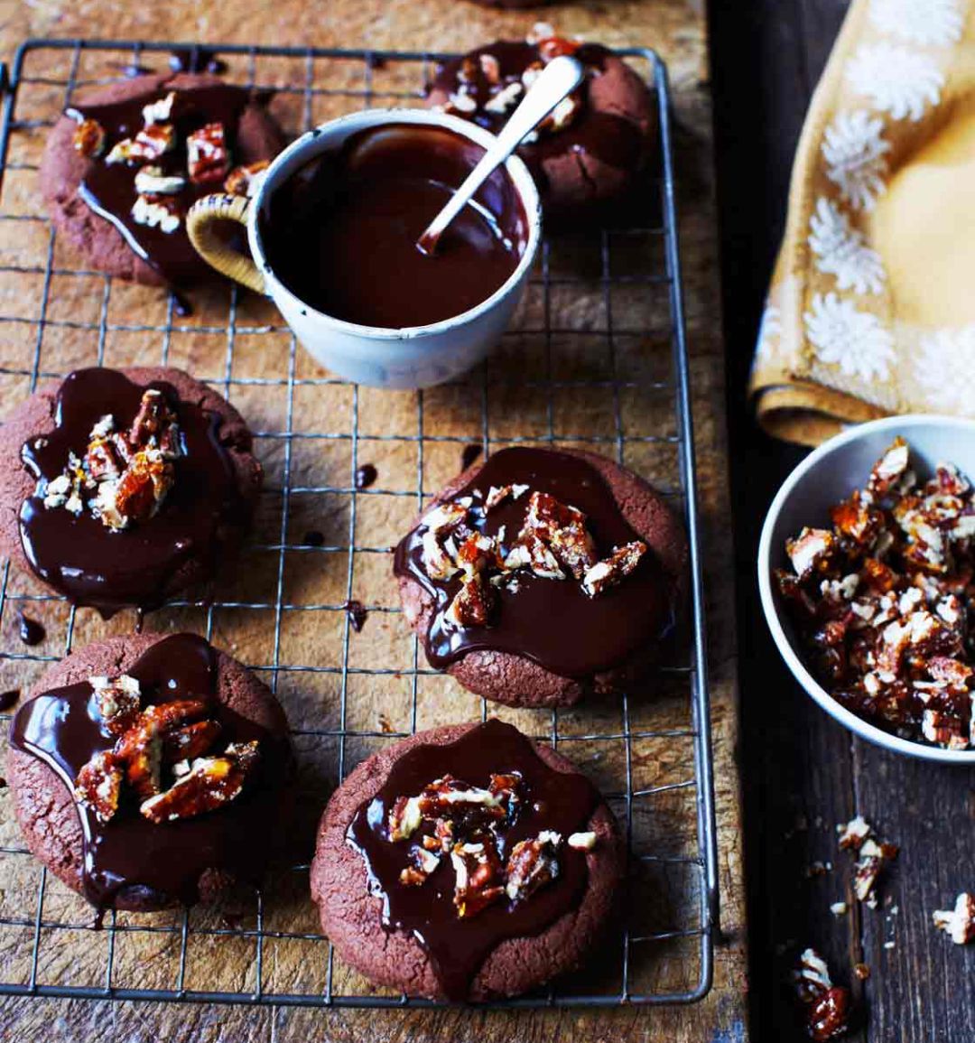 Decadent chocolate cookies with chocolate ganache and candied pecans