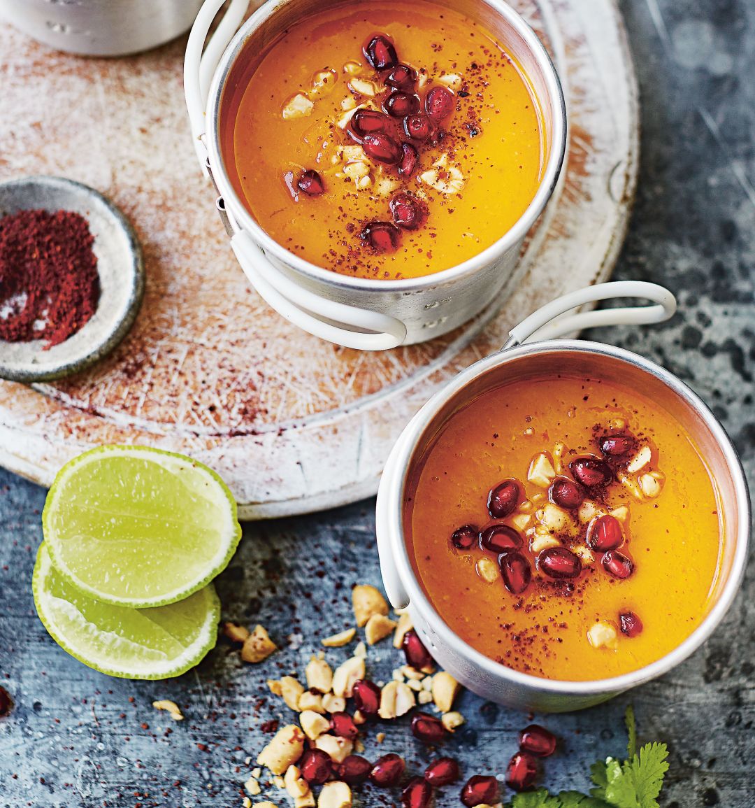 Sweet potato, sumac and pomegranate soup with roasted peanuts, coriander and lime