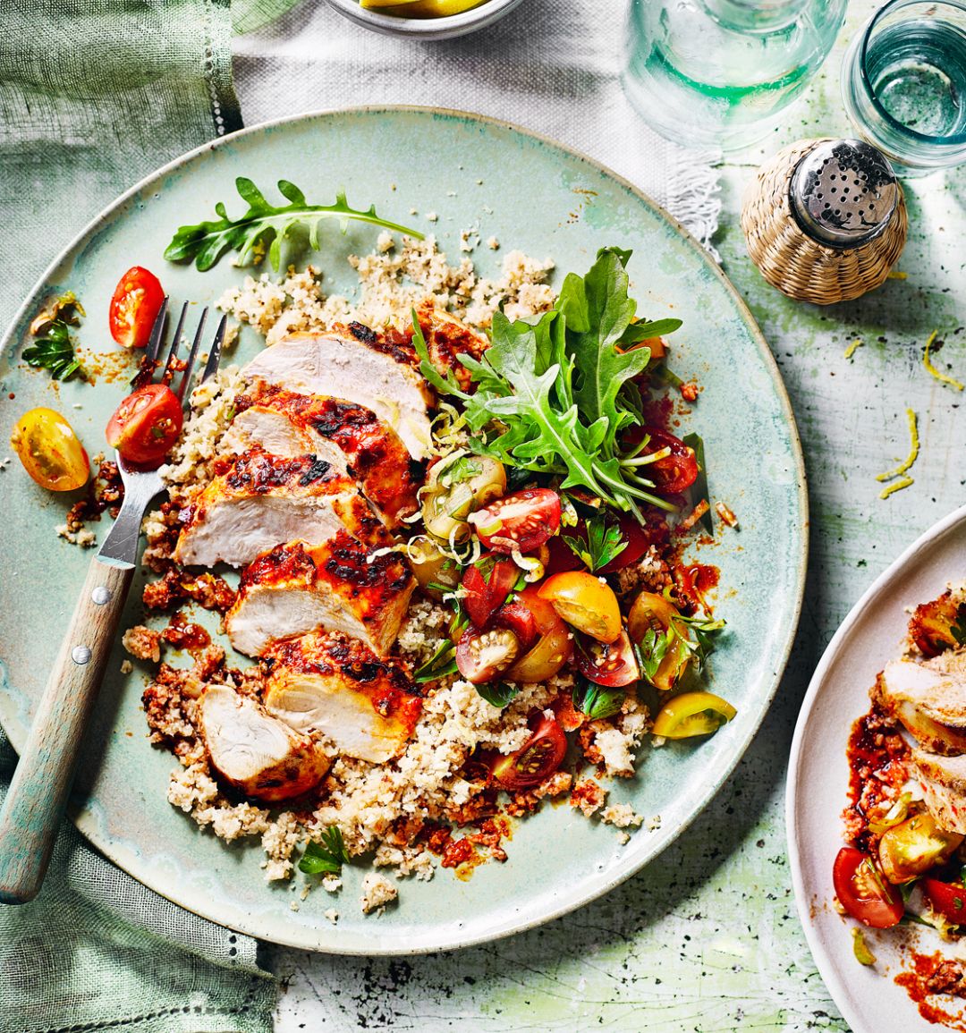 Harissa chicken with cauliflower couscous and chermoula tomatoes