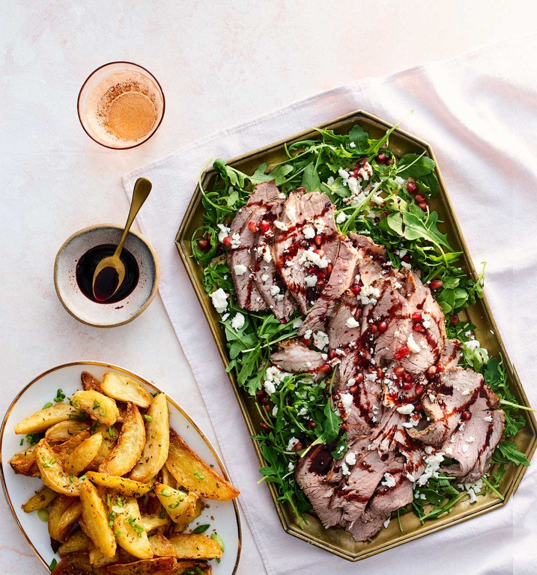 Pomegranate beef with spiced wedges