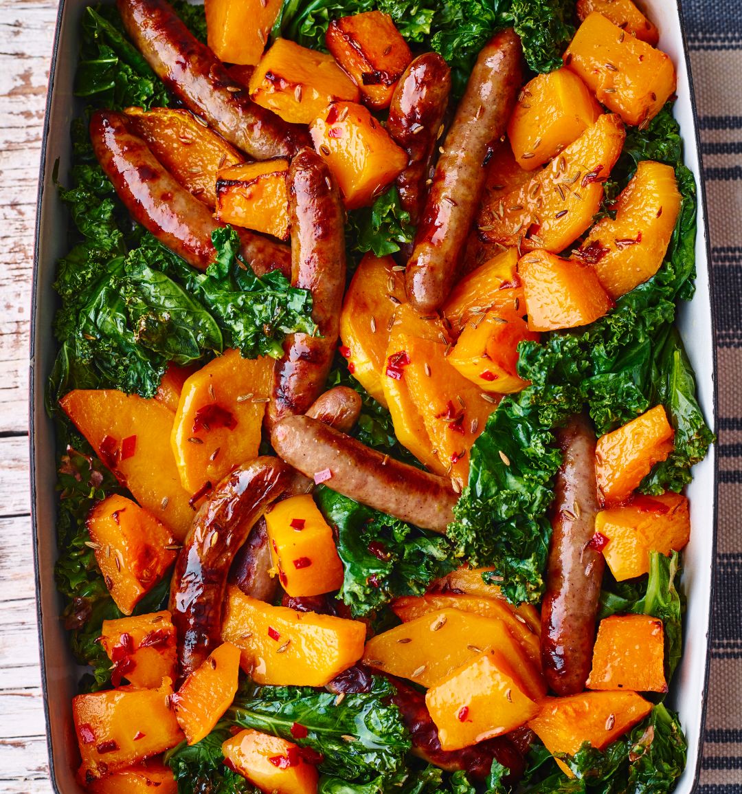 Sausage, butternut and kale traybake