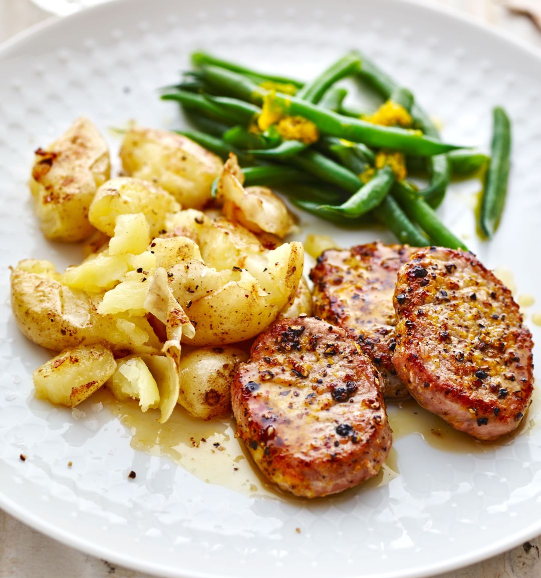 Citrus pepper pork with crushed potatoes