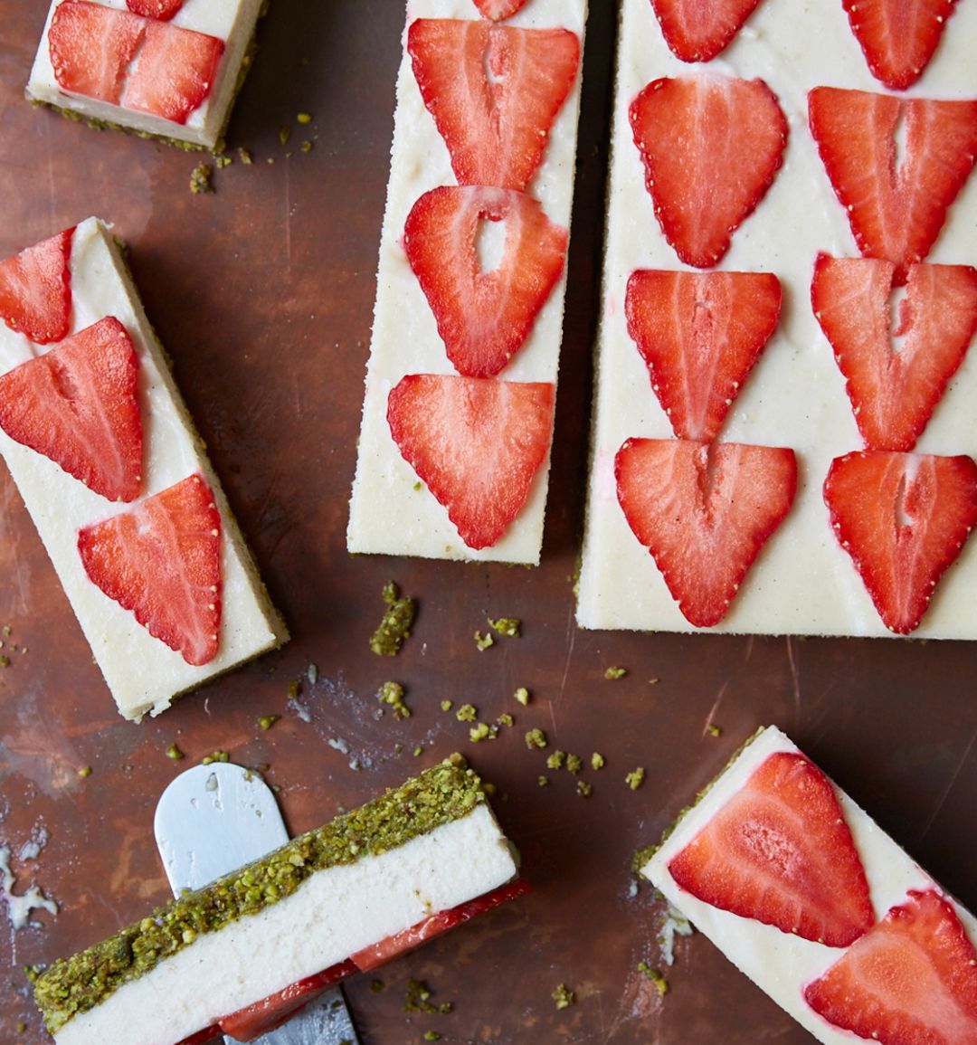 Raw vegan vanilla, strawberry and pistachio cheesecake