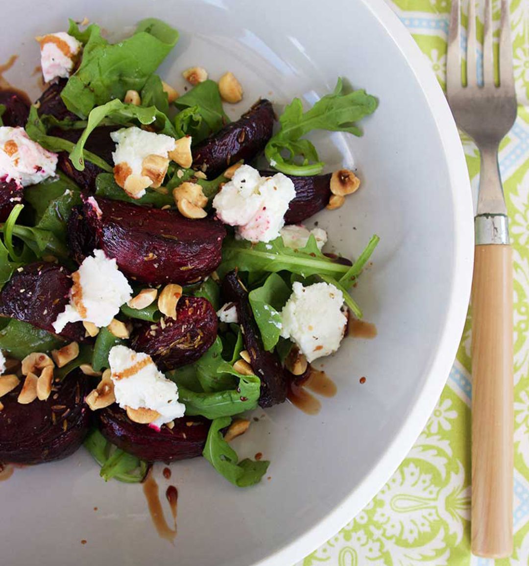 Salad of roasted beetroot, goat’s cheese and hazelnuts on wild rocket