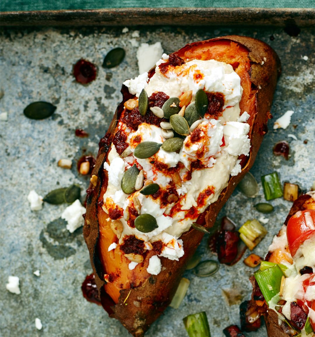 Baked sweet potato with houmous and harissa