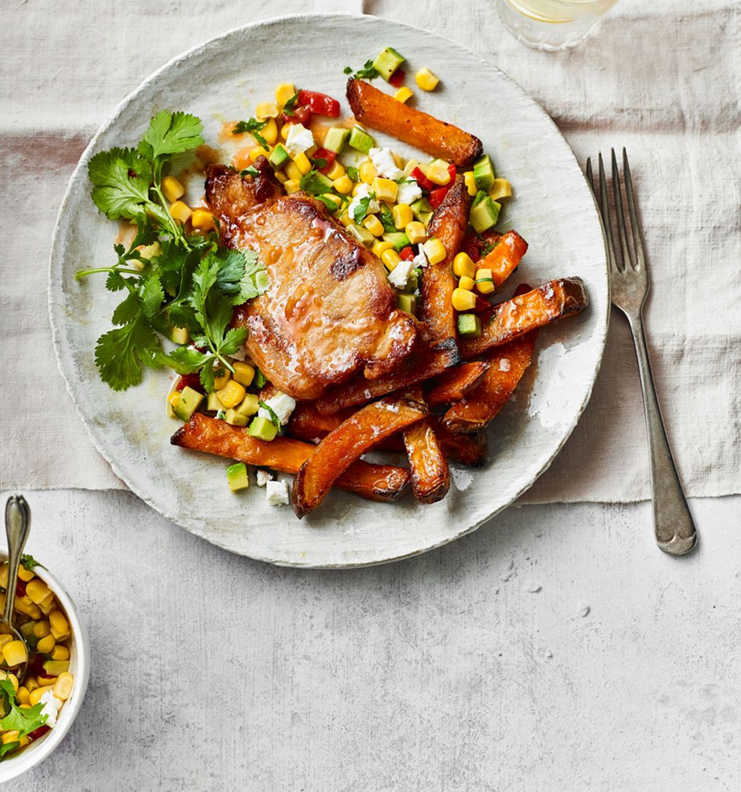 Peri peri pork with sweet potato wedges and sweetcorn salsa