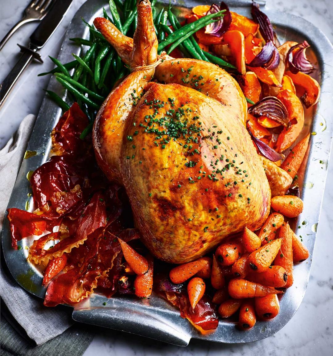 Creamy garlic roast chicken with crispy ham and veggies