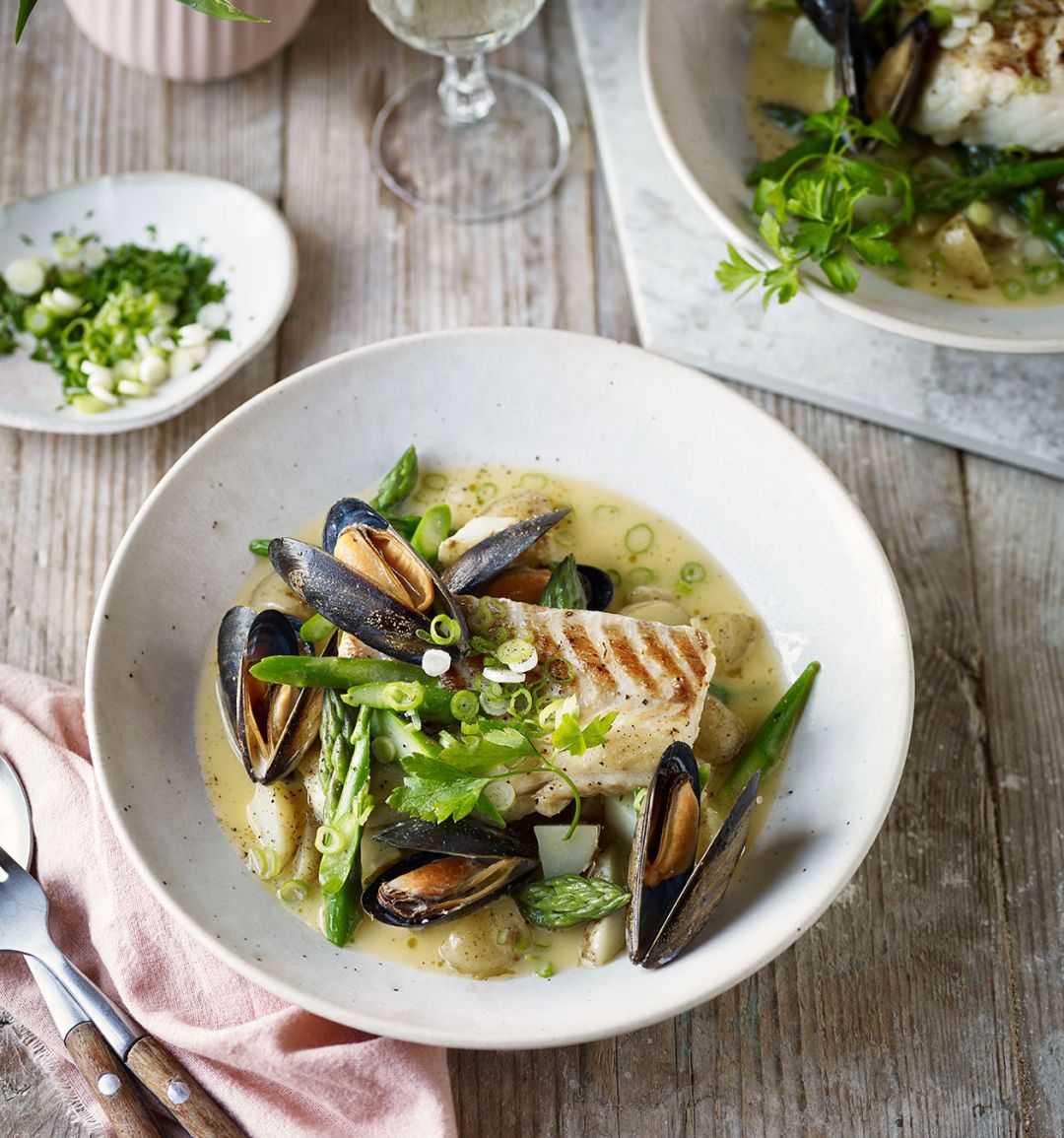 Cod with a spring broth of asparagus, Jersey Royals and mussels 