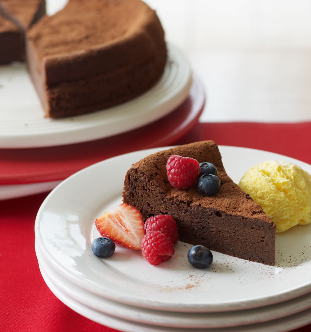 Chocolate brownie cake with berries and ice cream