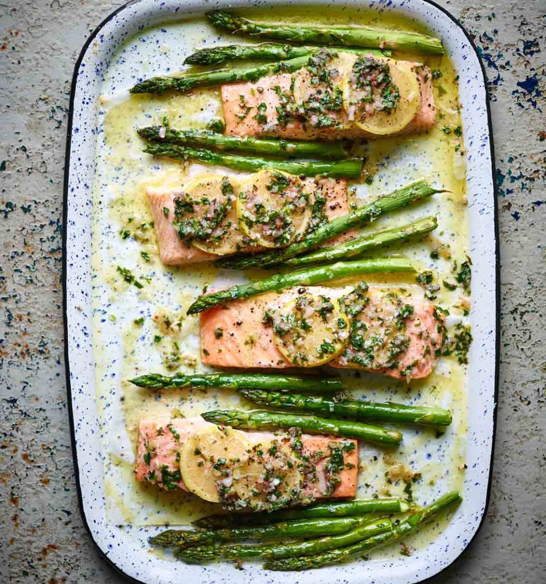 Salmon traybake with lemon butter and asparagus
