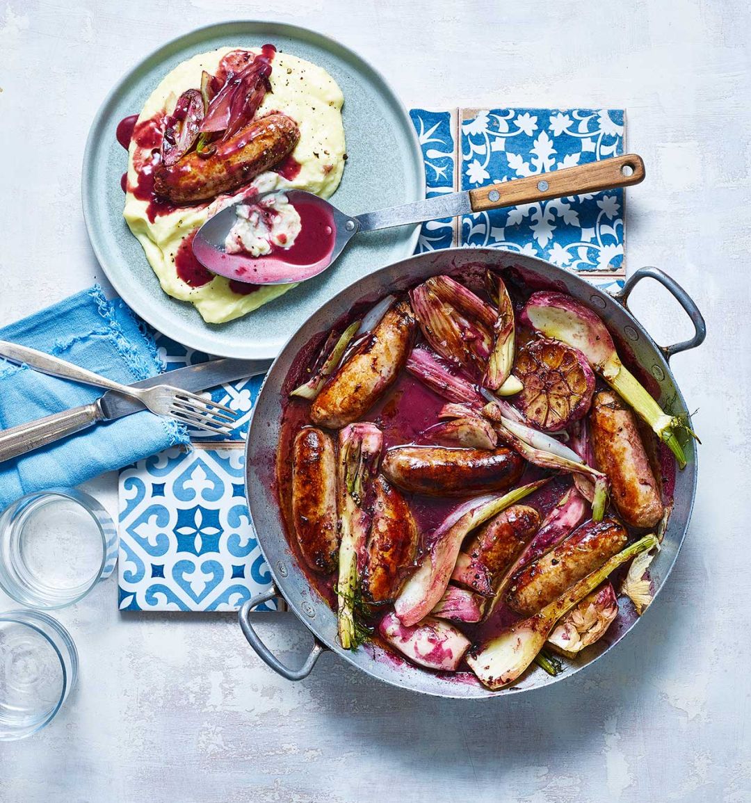Wine-braised sausages with olive oil mash