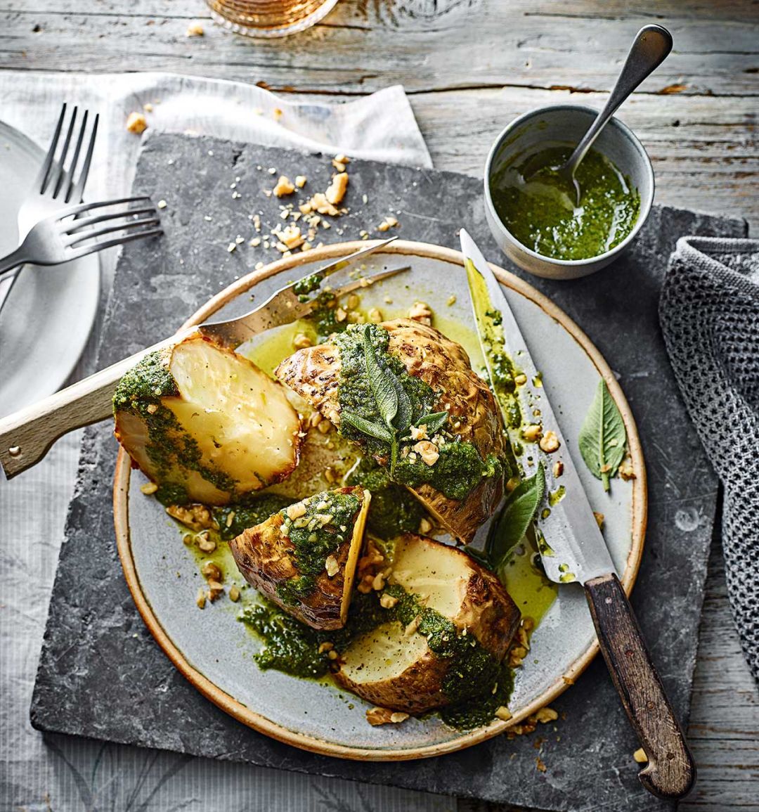 Whole roast celeriac with sage and walnut pesto