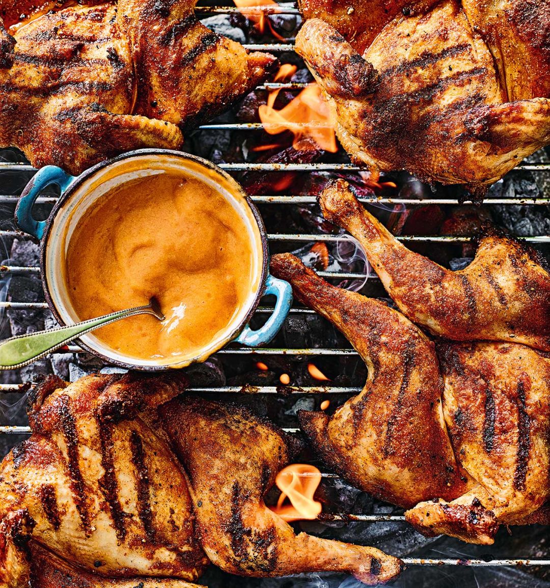 Spiced spatchcock poussins with barbecued peach sauce