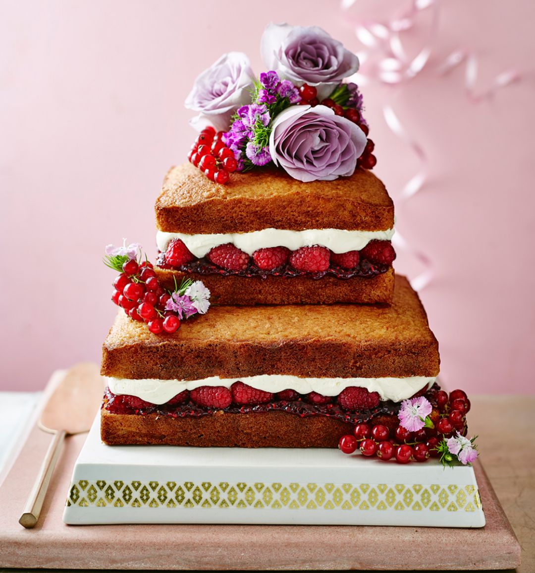 Naked citrus, raspberry and coconut celebration cake