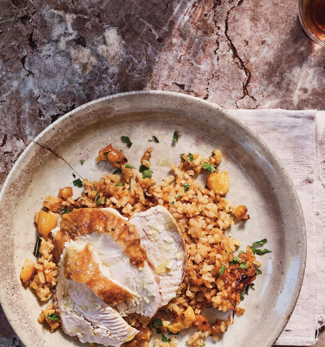 Roast chicken with orange, cumin and apricot rice