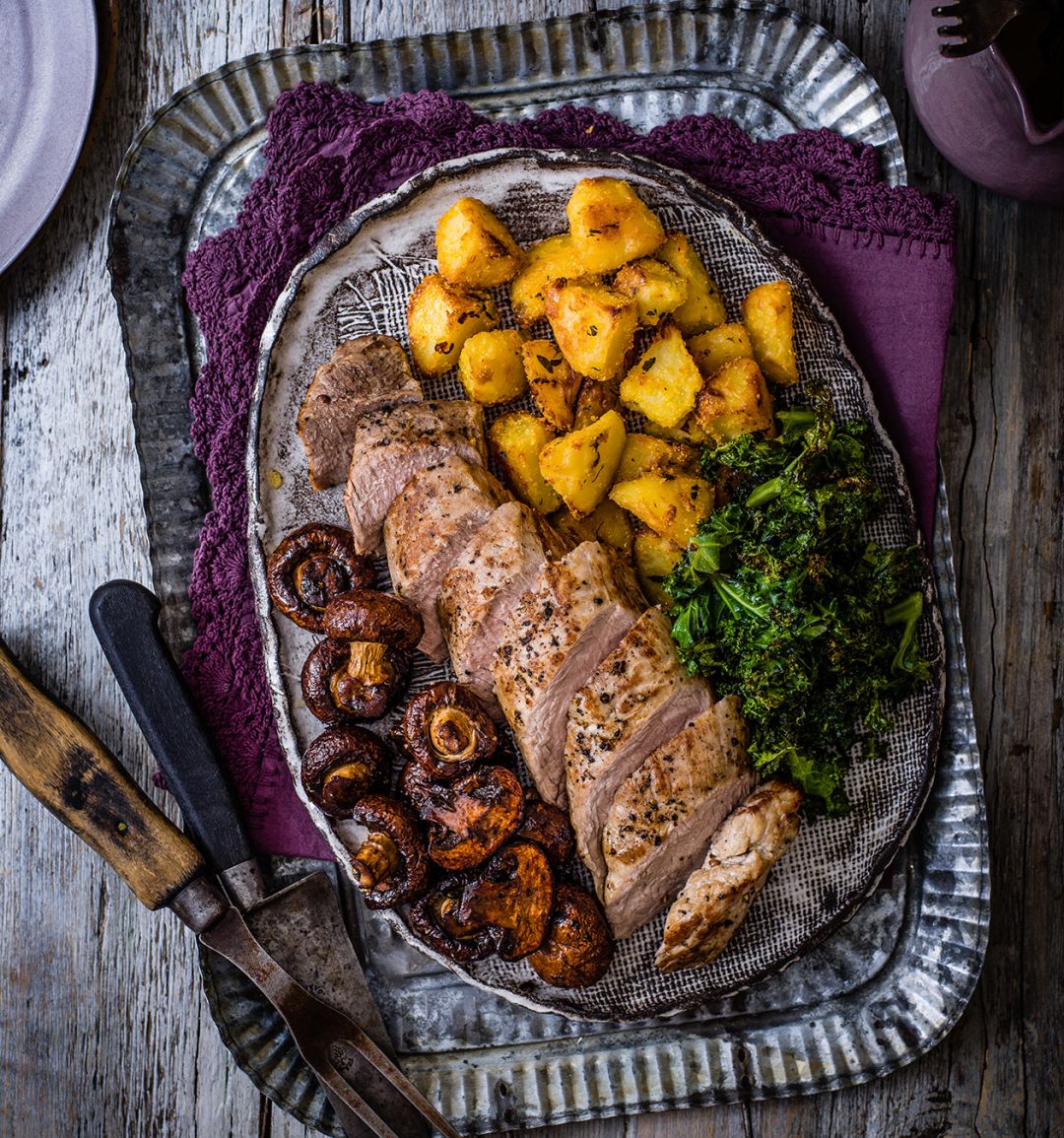 Roast pork with balsamic mushrooms, crispy potatoes & kale