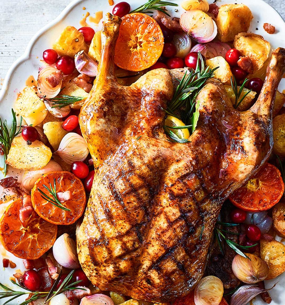 Sticky citrus roast duck with crispy potatoes
