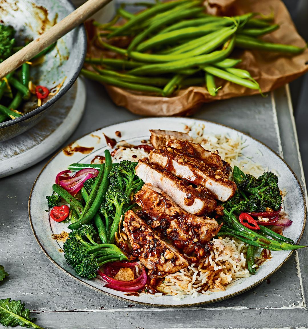 Sticky peanut pork with stir-fried purple sprouting broccoli
