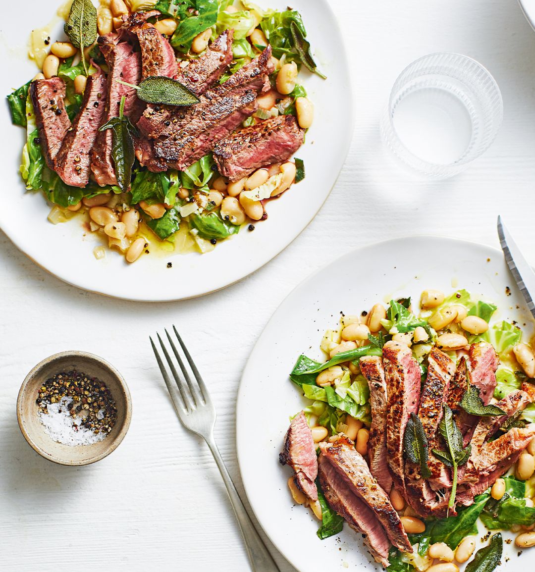Steak with braised beans and greens