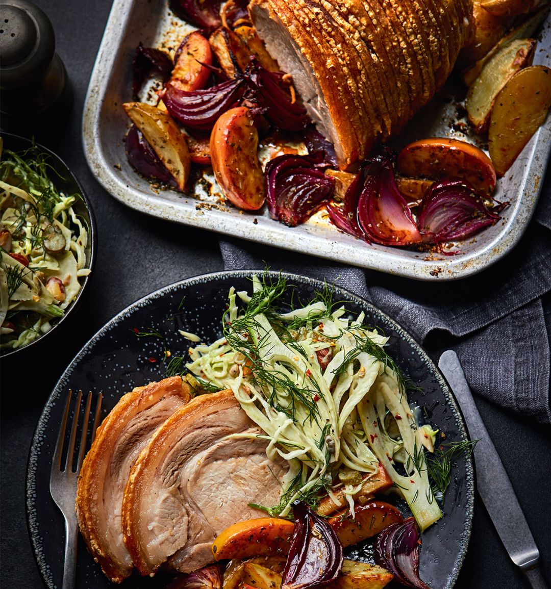 Crackling good pork and apple traybake with crunchy pickle slaw