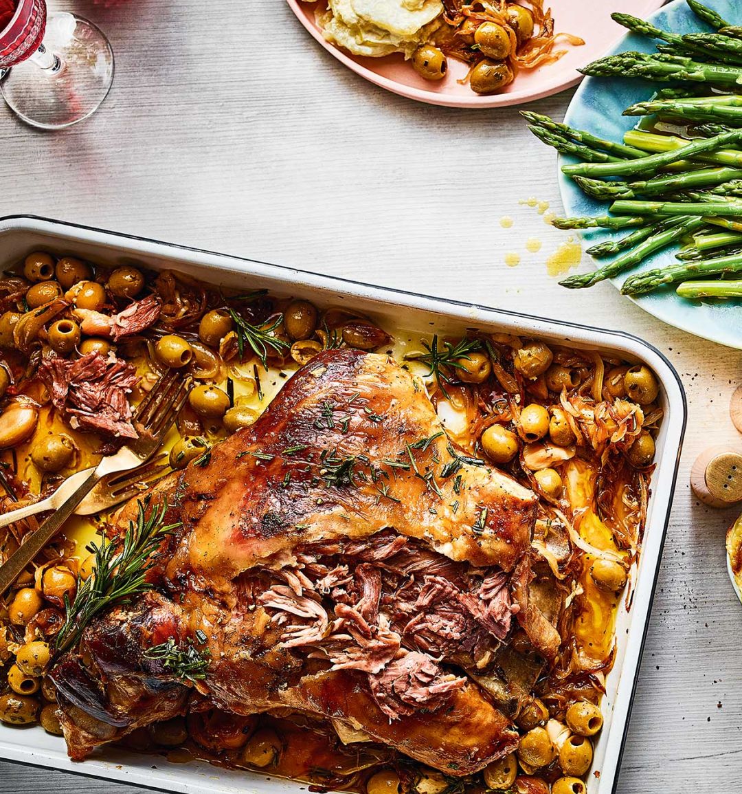 Lamb shoulder, caramelised onions and olives with buttered asparagus