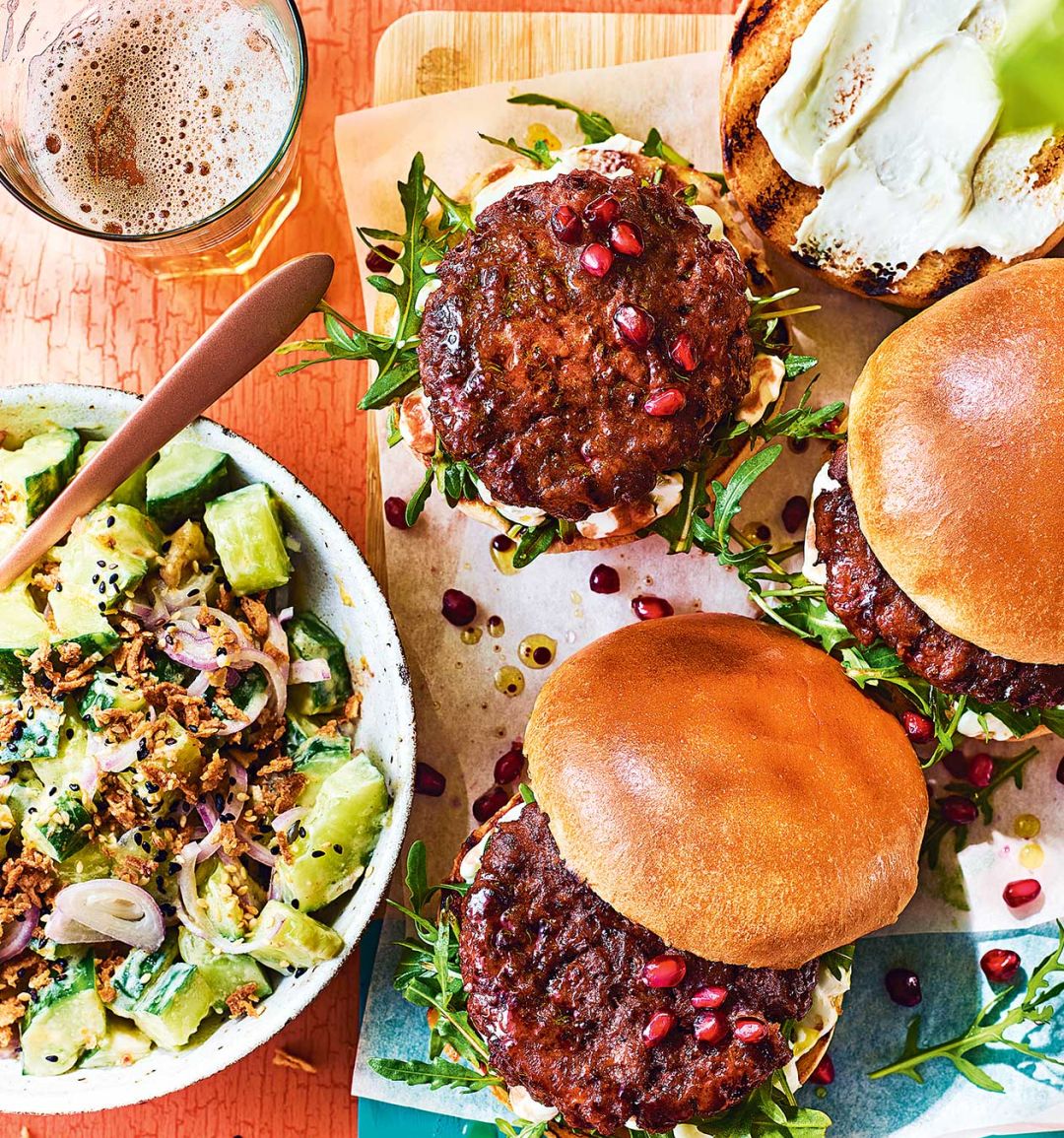 Sticky pomegranate beef burgers with tahini-cucumber salad